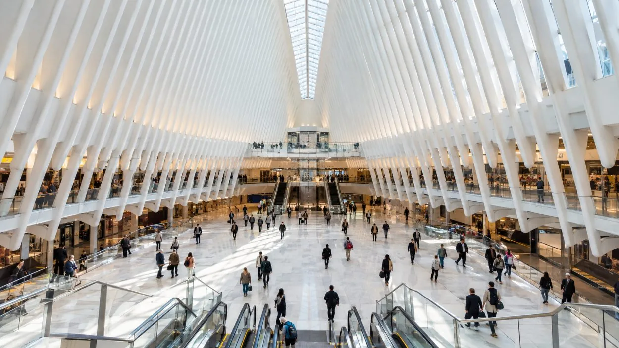 The white ribs of the Oculus transit hall with commuters crossing the floor