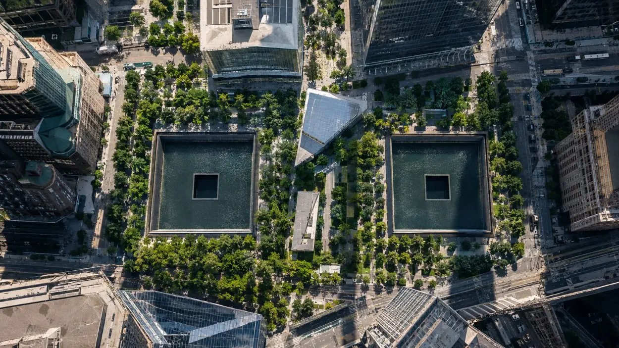 The World Trade Center site from above with the two square pools among trees